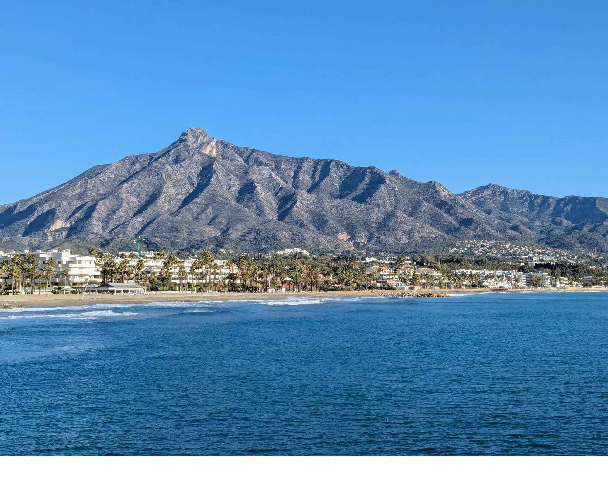 A coastal photo shown before and after marking
